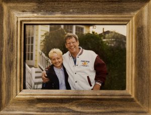Picture of Sherry and Bill Cannon smiling in a wooden frame